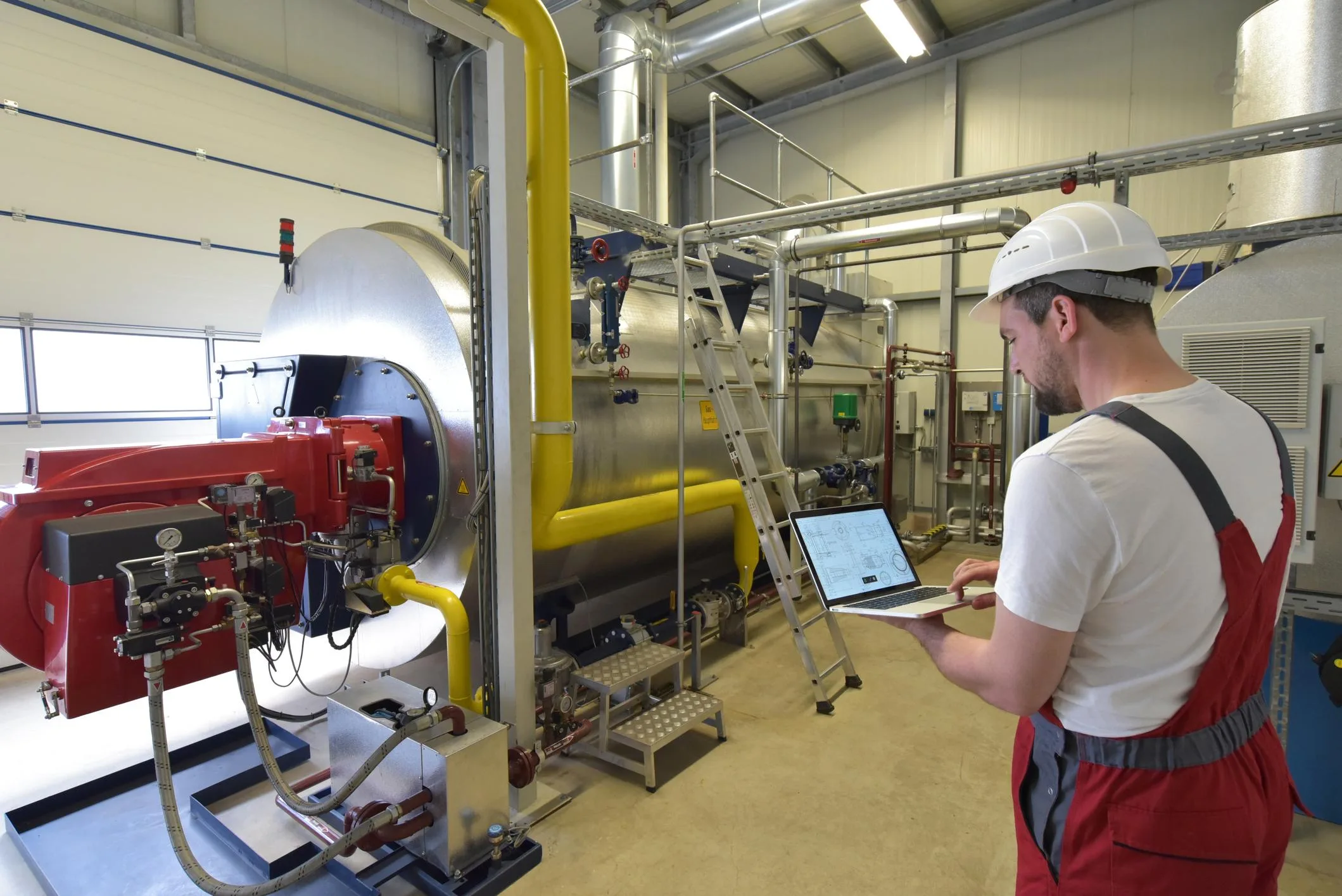 Engineer monitoring industrial systems in a plant